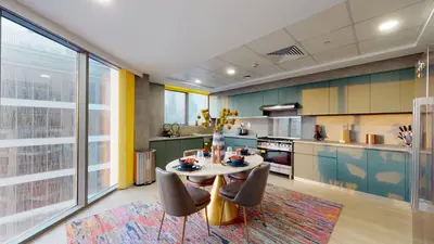 a kitchen with a table and chairs in a room at High-End Designer Penthouse Full Burj Khalifa View in Dubai