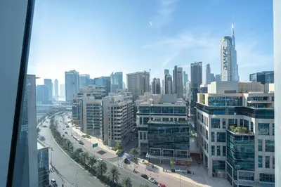 a view of a city with buildings and a street at Cosmopolitan Apartment with Burj Khalifa View in Dubai