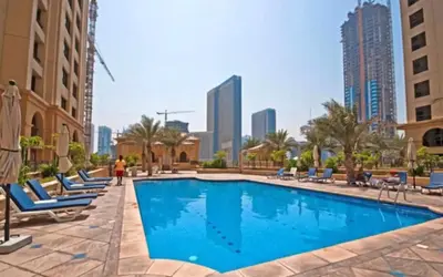 a swimming pool in the middle of a city with buildings at 2BR in JBR / Sea View / Dubai Marina / Walk2Beach in Dubai