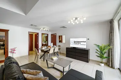 a living room with a couch and a table at 2BR in JBR / Sea View / Dubai Marina / Walk2Beach in Dubai