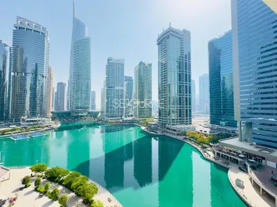 a river in a city with tall buildings at DA86 - Well Design Studio in Dubai Arch tower in Dubai
