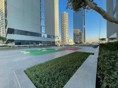 a courtyard in a city with tall buildings at Spectacular Views of Dubai Skyline in Dubai