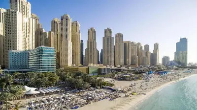 a view of a beach in front of a city at Luxury JBR Shams - Marina View - Free 5 star Beach Resorts Access! in Dubai