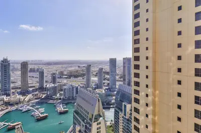 a view of a city with a river and buildings at Luxury JBR Shams - Marina View - Free 5 star Beach Resorts Access! in Dubai