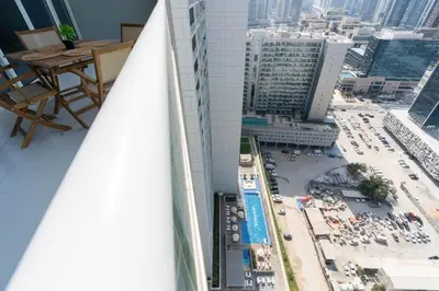 a view from the balcony of a building with a pool at Gala Guests - Marasi Drive City View Apartments in Dubai