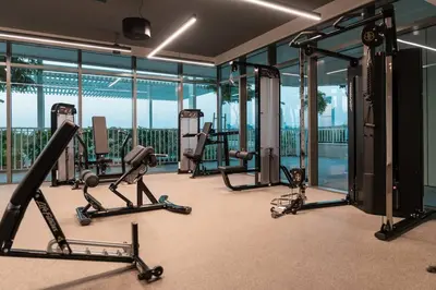 a gym with treadmills and machines in a building at prime retreats - beach vista Emaar in Dubai
