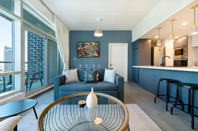 a living room with a couch and a table at Maison Privee - Balinese Style Apt in the Heart of Downtown Dubai in Dubai