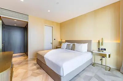 a bedroom with a large white bed in a room at Daniels Five Palm Sea View 2BR with Maids Room in Dubai