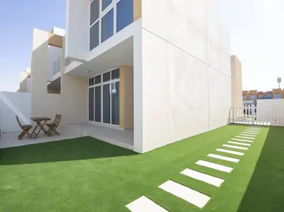 a rendering of a house with a green lawn at Corner 3Bedroom Townhouse in Avencia Cluster DH2 in Dubai