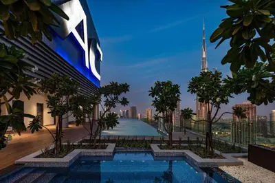 a rendering of a swimming pool with a city skyline at Paramount Midtown Deluxe 1 BR Apartment with Full Burj-Khalifa View in Dubai