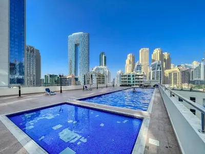 a large swimming pool on the roof of a building at The Smart Concierge - DEC Tower in Dubai