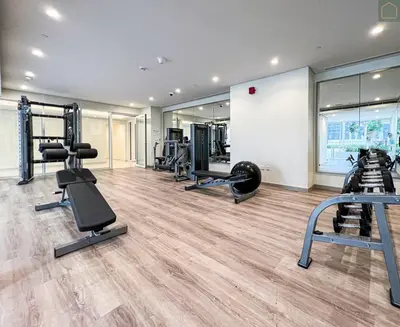 a gym with several treadmills and machines in it at ONYX - Full Burj Khalifa View Dubai 2 BEDROOM APARTMENT - DOWNTOWN DUBAI in Dubai