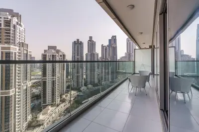 an apartment balcony with a view of the city at GuestReady - Fabulous 2BR with Burj Khalifa view in Dubai
