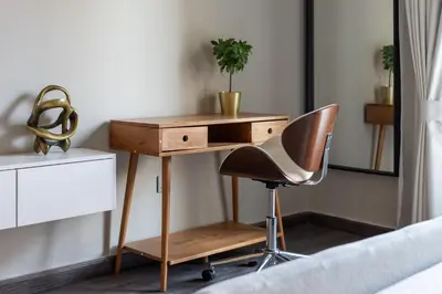 a desk and a chair in a bedroom at Luxury studio in Discovery Gardens near metro in Dubai