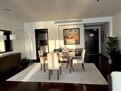 a dining room with a table and chairs at Marvelous private beach apartment in Palm Dubai within Anantara 5 star resort in Dubai