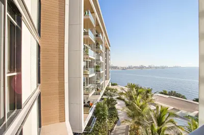 a view of the ocean from a building at Phenomenal 2BR with Scenic Sea-View from ALL rooms! in Dubai