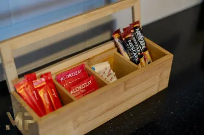 a wooden box filled with different types of snacks at Marco Polo - Wake up to breathtaking Burj Khalifa views in Dubai