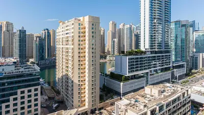 an aerial view of a city with tall buildings at Cosy 1 Bedroom Marina Apartment in Dubai