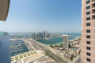 a view of the city of dubai from a skyscraper at White Sage - Fendi Apartment With Full Palm Jumeirah View in Dubai