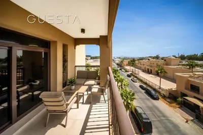 a balcony with chairs and a view of a street at Lamtara 1 - Madinat Jumeirah Living, Jumeirah in Dubai