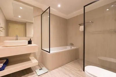 a bathroom with a tub and a sink and a shower at Palmar One Bedroom with Private Beach! in Dubai