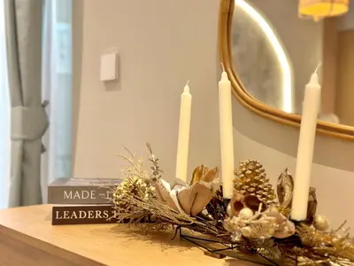 a group of candles on a table in front of a mirror at Family apartment next to the beach in Dubai