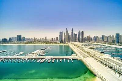 a view of the city of dubai from the marina at Sunrise Bay 2, Emaar Beachfront - Mint Stay in Dubai