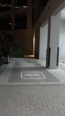 a car parked in front of a building at a chilled place in Dubai