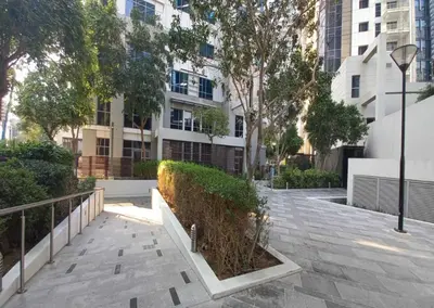 a sidewalk in a city with a building at Luxury 1BR Apartment Executive Towers Business Bay in Dubai