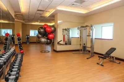 a gym with cardio equipment and balloons in a room at Dubai Marina Gem - Elite Residences 1BHK Retreat 4501 in Dubai