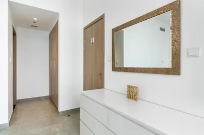 a bathroom with white cabinets and a mirror at Vacay Lettings - Waterfront Luxury home with full Marina view in Dubai