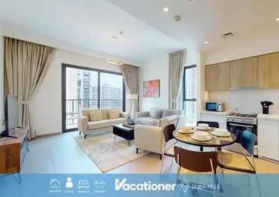 a living room with a couch and a table at Vacationer I Executive 1 Bedroom I Free Parking & Wi-Fi in Dubai