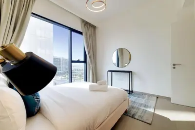 a hotel room with a bed and a large window at Vacationer I Executive 1 Bedroom I Free Parking & Wi-Fi in Dubai