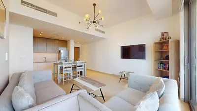 a living room with a couch and a kitchen at 5242 Tower 2 - Light One Bedroom in Dubai