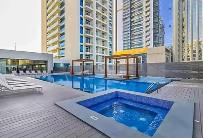 a swimming pool on a building with tall buildings at Stylish Apartment Balcony and Sea Views in Dubai