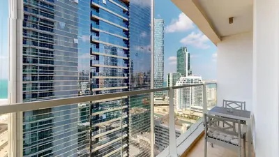 a balcony with a view of a city skyline at Stylish Apartment Balcony and Sea Views in Dubai
