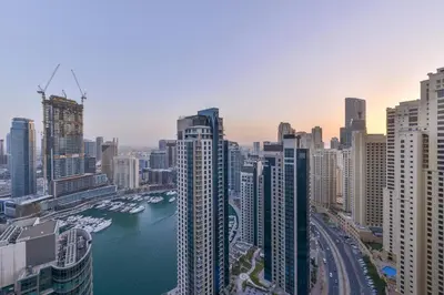 a view of a city with a river and buildings at Luxury JBR · Marina View · 5* Beach Resorts Access in Dubai