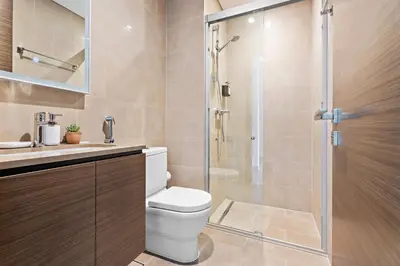a bathroom with a toilet and a shower at New 2 bedroom in Meydan - Green Area in Dubai