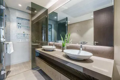 two sinks on a counter in a bathroom at GuestReady - Luxe Suite in Jumeirah Marina in Dubai