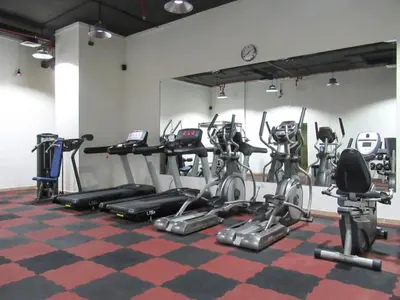 a gym with a bunch of exercise bikes in a room at Frank Porter - Marina Views T1 in Dubai
