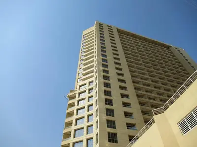 a tall building with a blue sky in the background at Frank Porter - Lakeside Tower D in Dubai