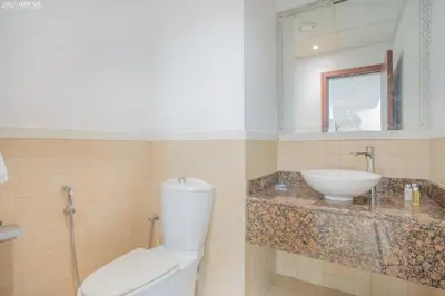 a bathroom with a toilet and a sink at JBR - Apartment plus maid in Dubai