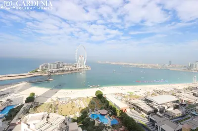 a view of a beach with a ferris wheel in the water at JBR - Shams Suites - Sea & Marina View Walking Distance to The Beach by Gardenia in Dubai