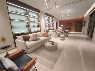 a living room with two couches and a table at Modern 1 bedroom - Close to Business Bay - Sobha Creek Vista in Dubai