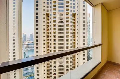a balcony with a view of a tall building at Nice and comfy 2BD apartment in Jbr in Dubai