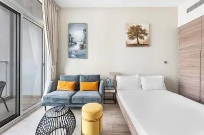 a small room with a bed and a couch at ALiving Cozy Studio with Canal View I Studio One, Dubai Marina in Dubai