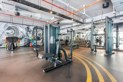 a gym with treadmills and machines in a building at ALiving Cozy Studio with Canal View I Studio One, Dubai Marina in Dubai