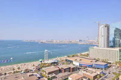 a view of a beach with buildings and the ocean at Deluxe Retreat In JBR - Million Dollar View - Balcony in Dubai