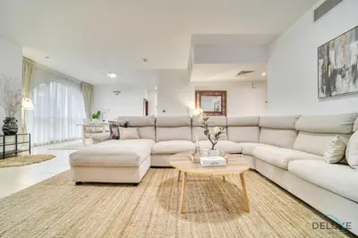 a living room with a couch and a table at Serene 1BR at Murjan 2 JBR by Deluxe Holiday Homes in Dubai
