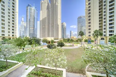 a park in the middle of a city with tall buildings at Serene 1BR at Murjan 2 JBR by Deluxe Holiday Homes in Dubai